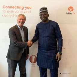 Oluwasayo Oshadami (right), GM, Technical Solutions, MainOne, and International Partnership Director Onno Bos (left) of AMS-IX, signed the deal during the African Peering Forum (AfPIF) in Kigali.